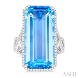 26x12 MM Emerald Cut Blue Topaz and 1/2 Ctw Round Cut Diamond Halo Semi-Precious Ring in 14K White Gold