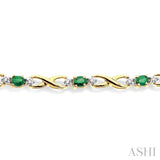 4x3 MM Oval Cut Emerald and 1/10 Ctw Single Cut Diamond Bracelet in 14K Yellow Gold