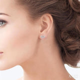 1/10 Ctw Petite Lips Round Cut Diamond Fashion Stud Earring in 10K White Gold