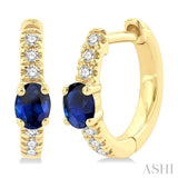 4X3 MM Oval Cut Sapphire and 1/10 Ctw Petite Round Cut Diamond Fashion Huggies in 10K Yellow Gold