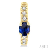 4X3 MM Oval Cut Sapphire and 1/10 Ctw Petite Round Cut Diamond Fashion Huggies in 10K Yellow Gold