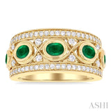 4x3 MM Oval and 2.8 MM Round Cut Emerald and 3/8 Ctw Curvy Criss Cross Single Cut Diamond Precious Band in 14K Yellow Gold
